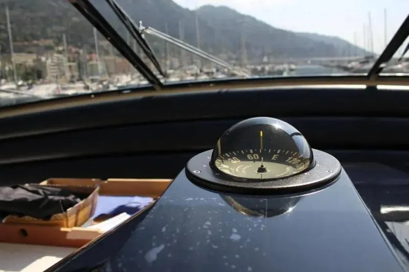  Yacht Photos Pics Compass on Cantieri dell'Arno Leopard 27 open yacht, 2000 model, with scenic marina view.