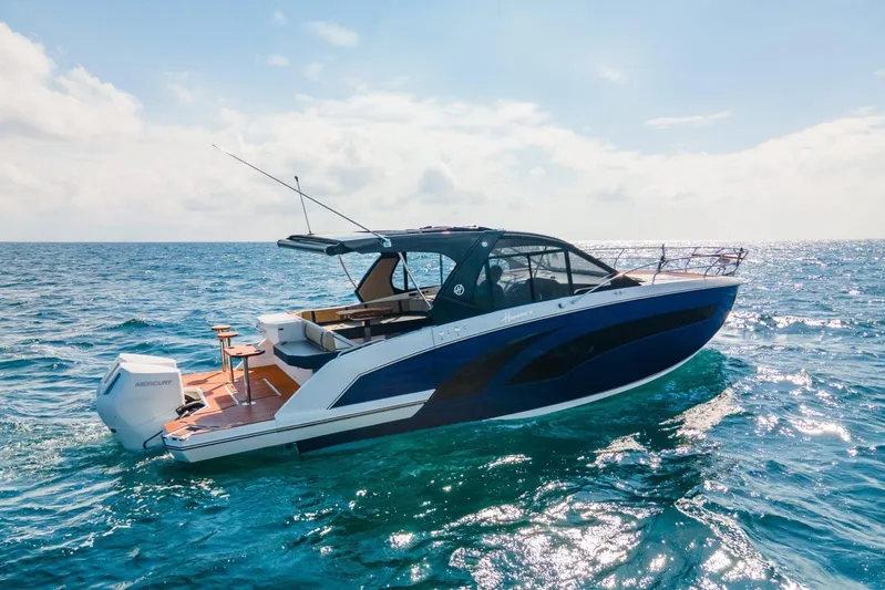  Yacht Photos Pics 2024 Hanover 387 boat cruising on open sea under clear sky.