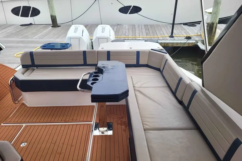  Yacht Photos Pics Luxurious seating area on a 2024 Hanover 387 boat with elegant wood flooring.