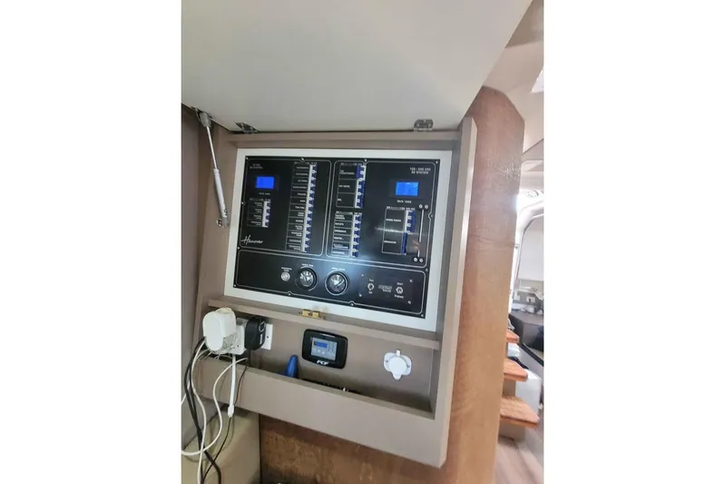  Yacht Photos Pics 2024 Hanover 387 control panel with digital displays and switches in a modern interior.