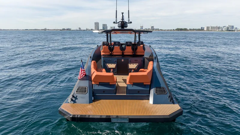  Yacht Photos Pics 2023 Lekker 44 yacht on open water with city skyline in background.
