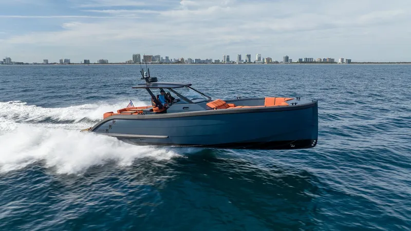  Yacht Photos Pics 2023 Lekker 44 boat cruising on open water with city skyline in the background.