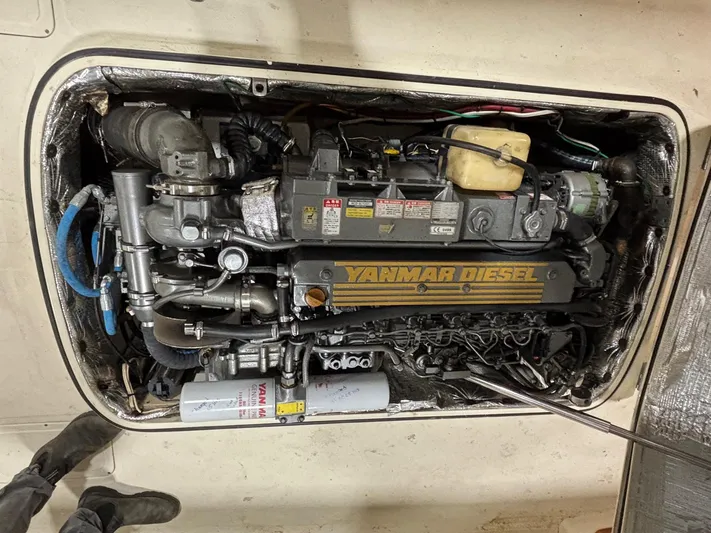 Celebration Yacht Photos Pics Engine compartment of a 2002 Hinckley Picnic Boat 36 with Yanmar diesel engine.