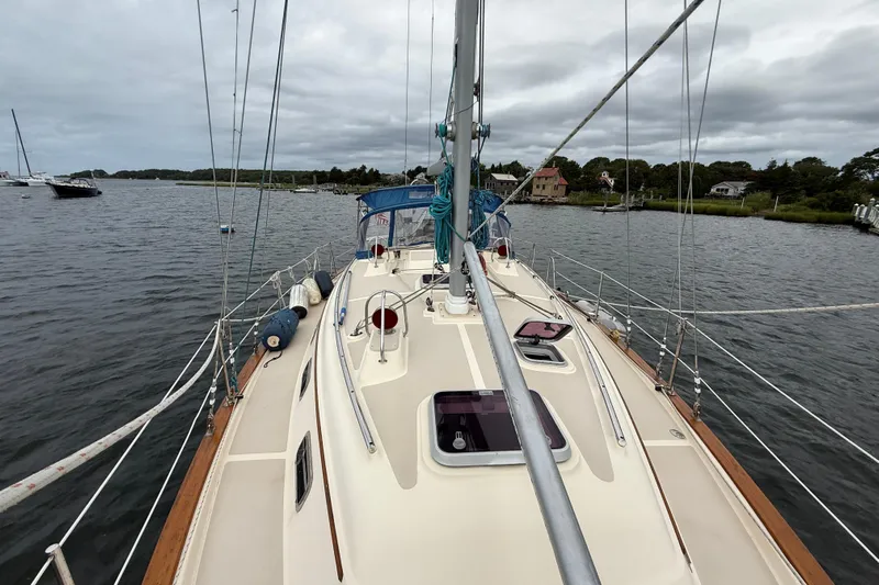 Pelican Yacht Photos Pics 2008 Island Packet 370 sailboat on calm waters, showcasing deck and rigging.