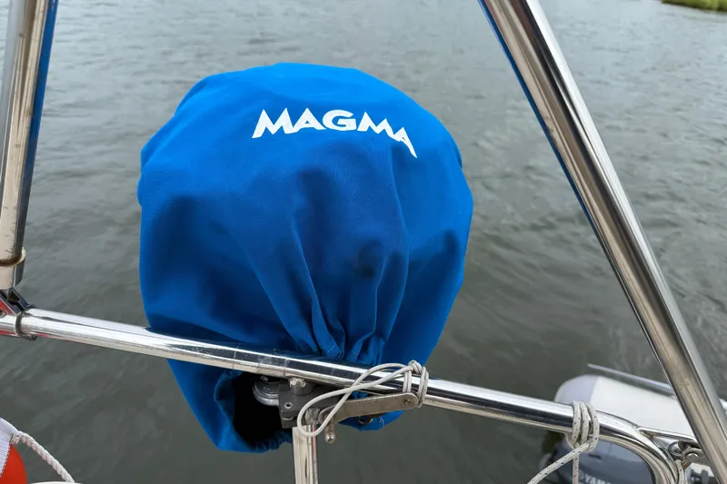 Pelican Yacht Photos Pics Blue Magma grill cover on Island Packet 370 sailboat, 2008 model, near water.