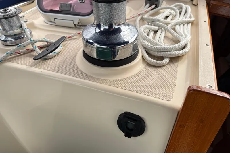 Pelican Yacht Photos Pics 2008 Island Packet 370 sailboat deck with winch, cleat, and coiled rope.