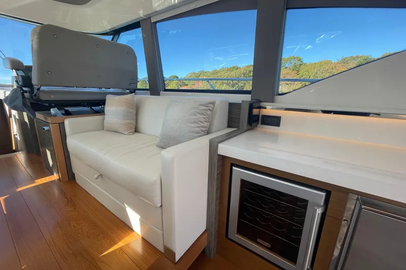 Bar Dog Yacht Photos Pics Luxurious interior of 2020 Tiara 53C yacht with plush seating and modern amenities.