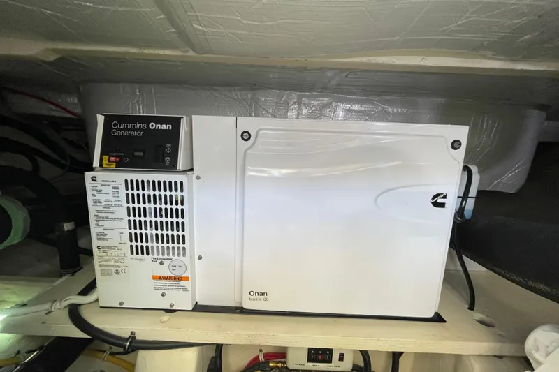 Bar Dog Yacht Photos Pics Cummins Onan generator in a 2020 Tiara 53C yacht engine room.