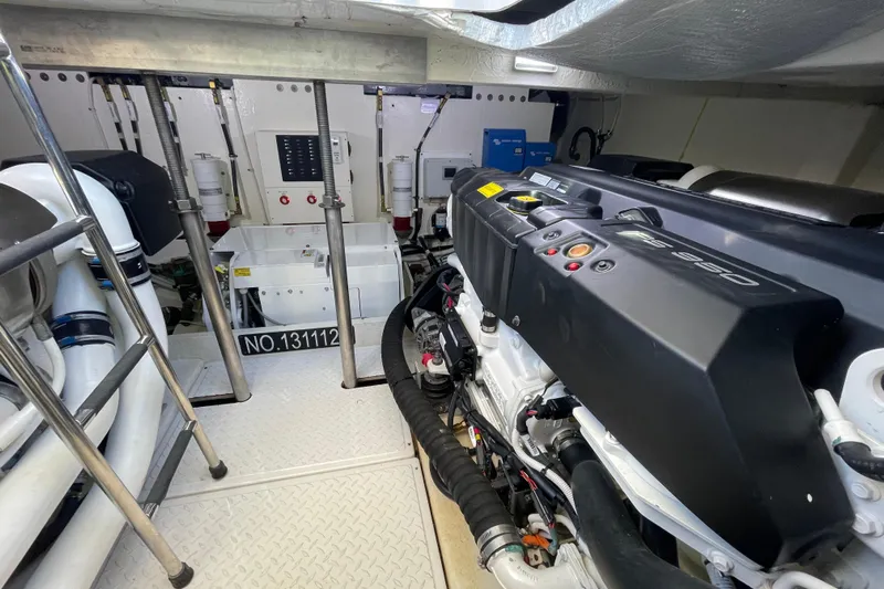 Bar Dog Yacht Photos Pics Engine room of a 2020 Tiara 53C yacht, showcasing advanced machinery and equipment.
