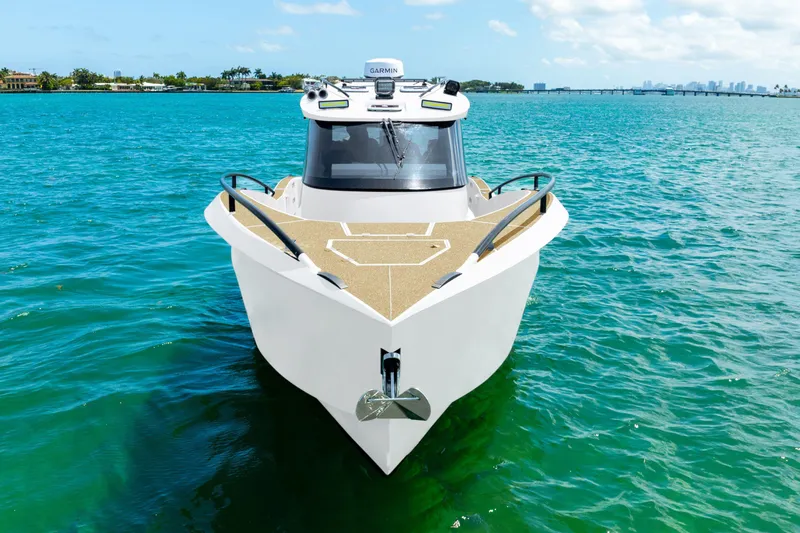  Yacht Photos Pics 2025 Novielli SERE boat on clear blue water, front view.