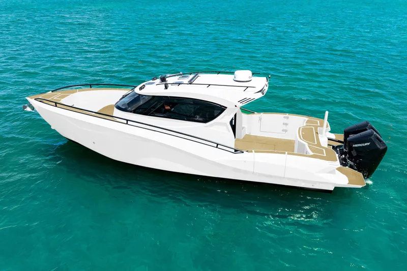  Yacht Photos Pics 2025 Novielli SERE boat on clear blue water, showcasing sleek design and powerful engine.