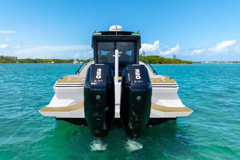  Yacht Photos Pics 2025 Novielli SERE boat with dual Mercury V10 engines on turquoise water.