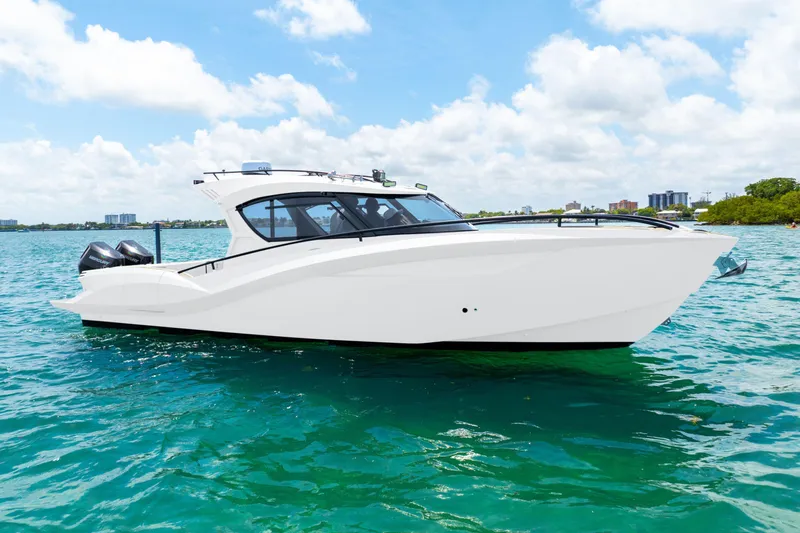  Yacht Photos Pics 2025 Novielli SERE boat on clear blue water under a sunny sky.