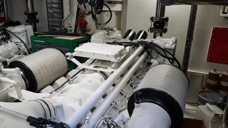  Yacht Photos Pics Engine room of a 1999 Azimut 100 Jumbo yacht, featuring mechanical components and equipment.