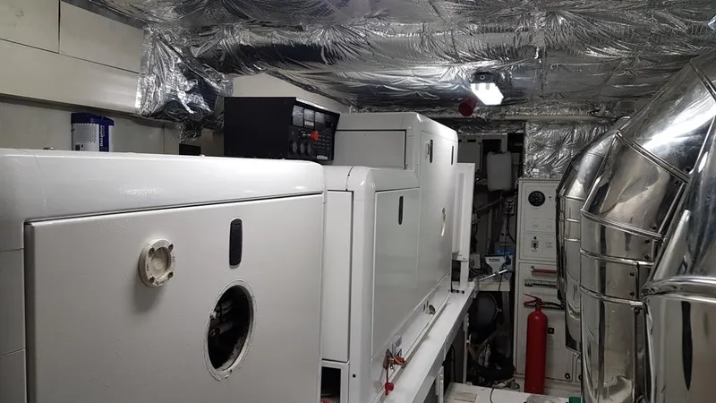  Yacht Photos Pics Engine room of a 1999 Azimut 100 Jumbo yacht, featuring machinery and equipment.