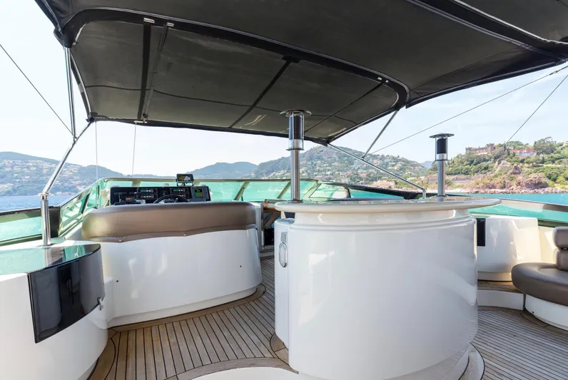  Yacht Photos Pics Luxurious 1999 Azimut 100 Jumbo yacht deck with elegant seating and scenic ocean views.