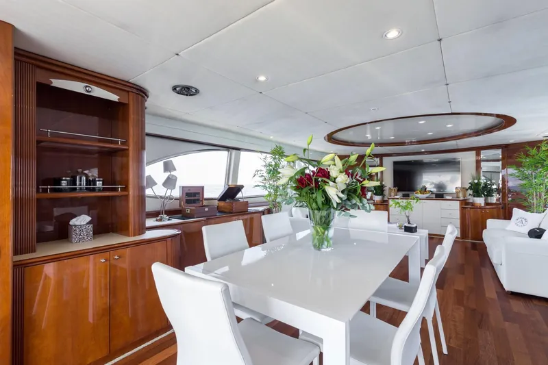  Yacht Photos Pics Luxurious interior of 1999 Azimut 100 Jumbo yacht with elegant dining area and modern decor.