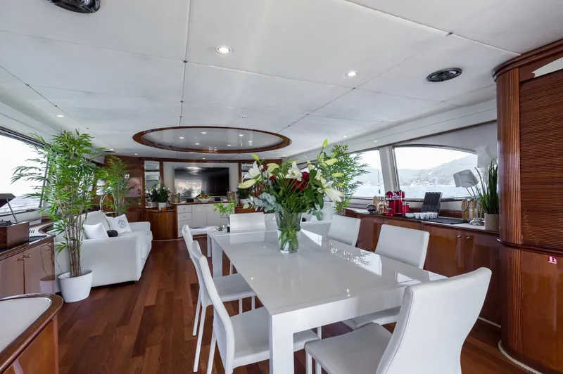  Yacht Photos Pics Luxurious interior of 1999 Azimut 100 Jumbo yacht with elegant dining area and modern decor.