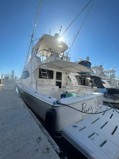  Yacht Photos Pics 2004 Riviera 40 yacht docked under clear blue sky.