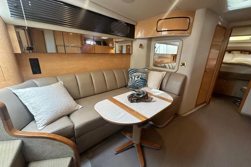 Bad Habit Yacht Photos Pics Luxurious interior of 1998 Sea Ray 450 Sundancer yacht with elegant seating and decor.