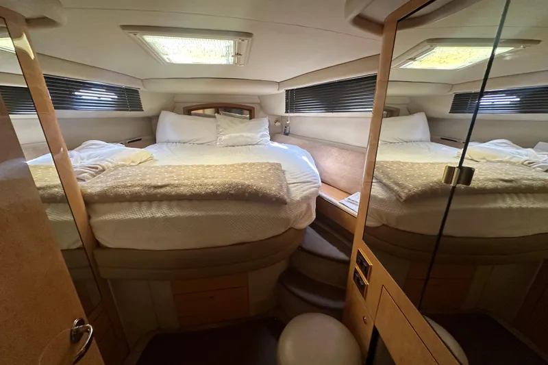 Bad Habit Yacht Photos Pics Luxurious cabin interior of a 1998 Sea Ray 450 Sundancer yacht with cozy bedding.