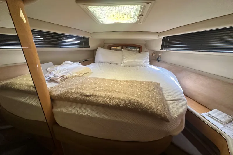 Bad Habit Yacht Photos Pics Cozy bedroom interior of 1998 Sea Ray 450 Sundancer yacht with plush bedding.