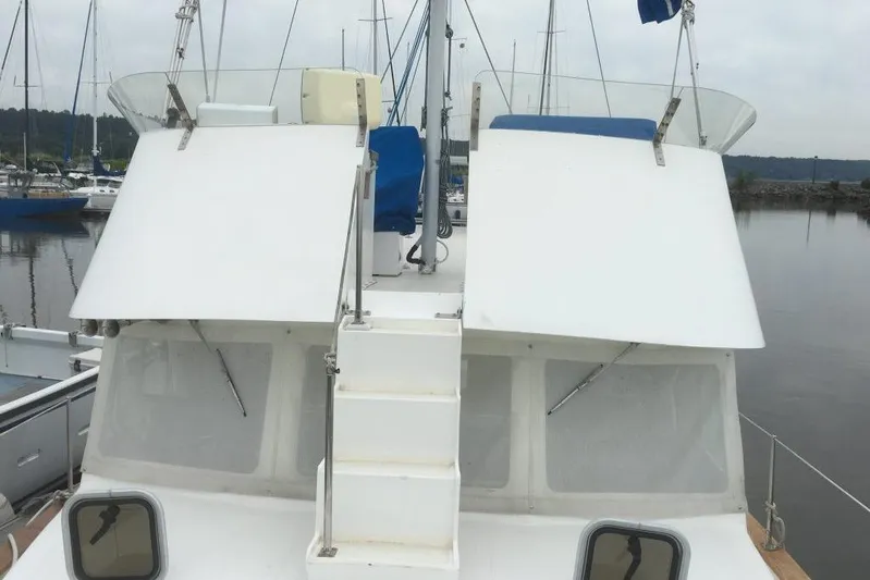  Yacht Photos Pics 1997 Willard Marine 40 Pilothouse Trawler docked, featuring a white exterior and pilothouse.