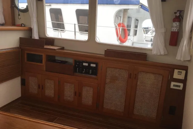 Yacht Photos Pics Interior of 1997 Willard Marine 40 Pilothouse Trawler with wooden cabinetry and nautical decor.