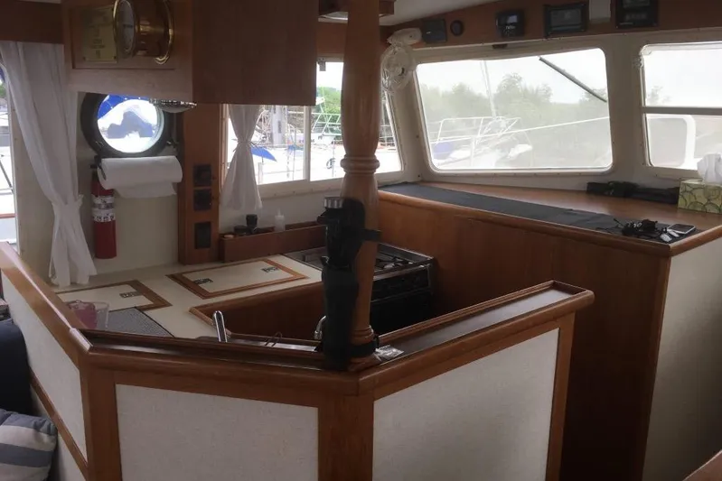  Yacht Photos Pics Interior of 1997 Willard Marine 40 Pilothouse Trawler with wooden finishes and large windows.