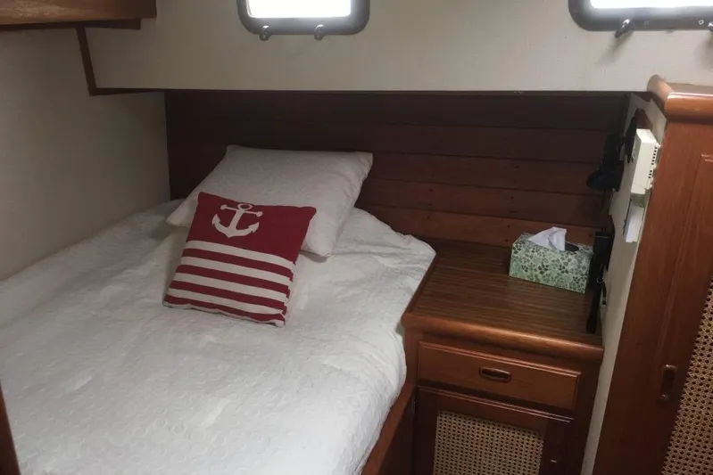  Yacht Photos Pics Cozy cabin interior of 1997 Willard Marine 40 Pilothouse Trawler with nautical-themed decor.
