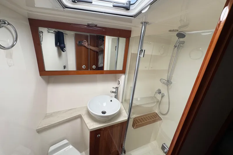  Yacht Photos Pics Luxurious bathroom in 2016 Riviera 43 Open Flybridge yacht with modern fixtures and shower.