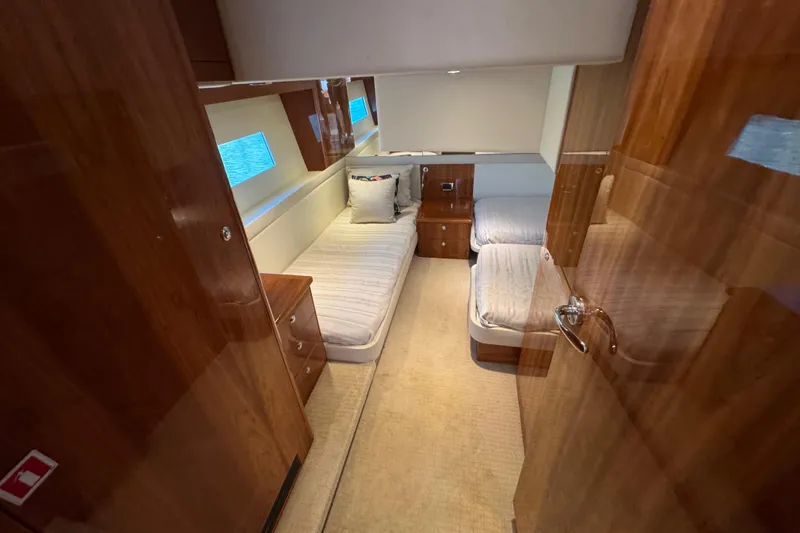  Yacht Photos Pics Luxurious cabin interior of 2016 Riviera 43 Open Flybridge yacht with twin beds.