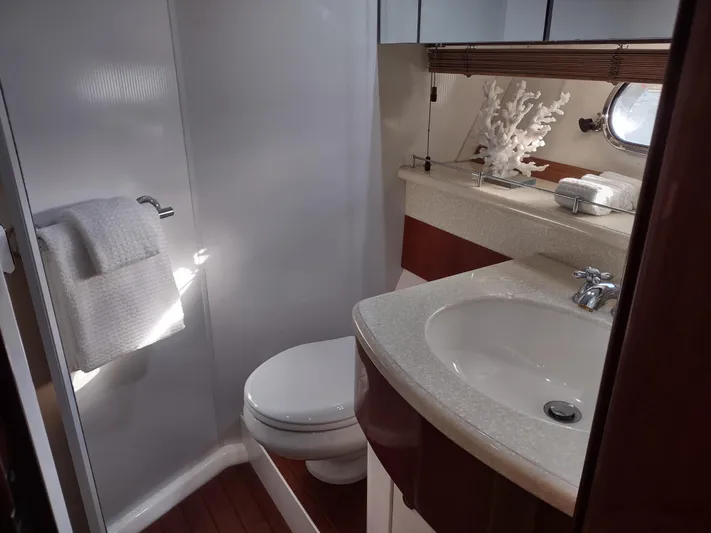 F66 Yacht Photos Pics Luxurious bathroom on a 1997 Fairline 66 yacht with modern fixtures and elegant decor.