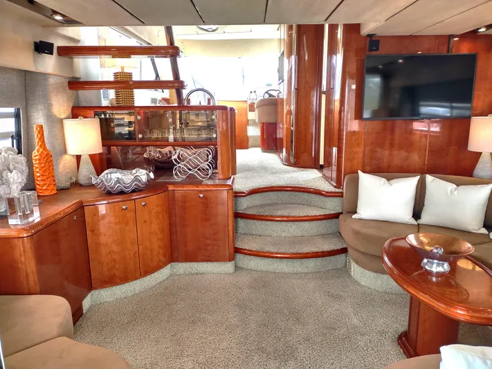F66 Yacht Photos Pics Luxurious interior of a 1997 Fairline 66 yacht with elegant wood finishes and modern decor.