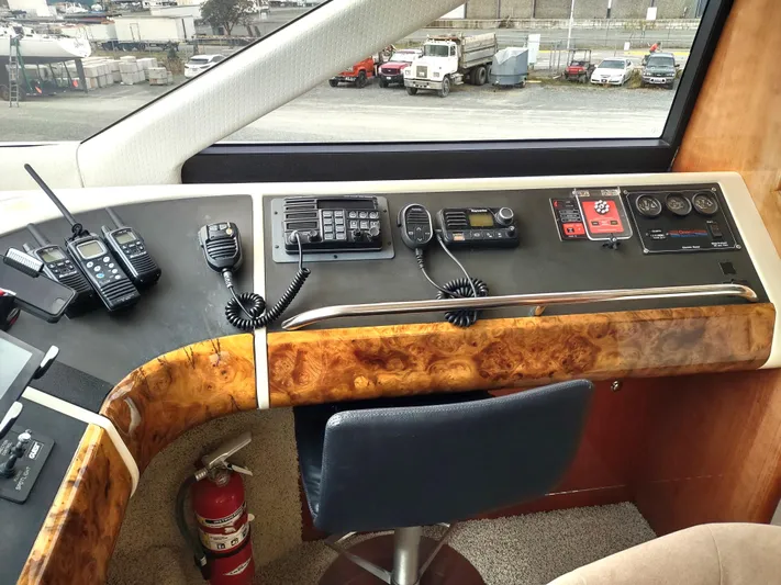 F66 Yacht Photos Pics Fairline 66 yacht helm station, 1997 model, with communication equipment and control panel.