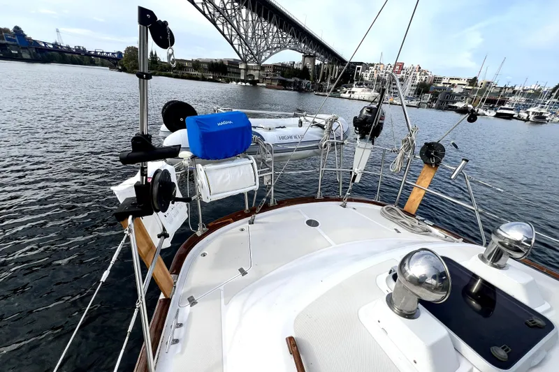  Yacht Photos Pics 1989 Taswell 43 sailboat deck view with marina and bridge in the background.