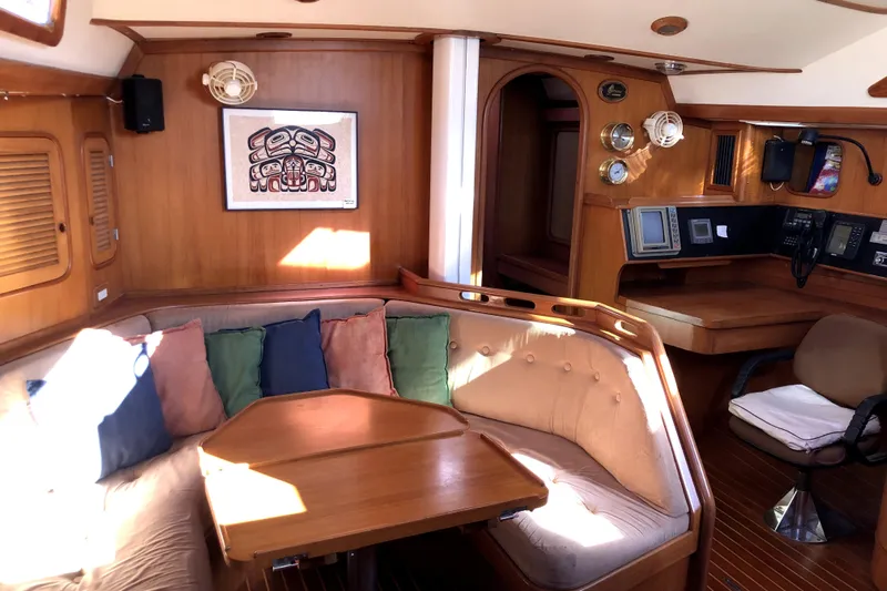  Yacht Photos Pics Interior of 1989 Taswell 43 yacht with cozy seating and navigation area.