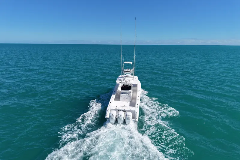  Yacht Photos Pics 2005 Venture 39 Open boat cruising on open ocean under clear blue sky.