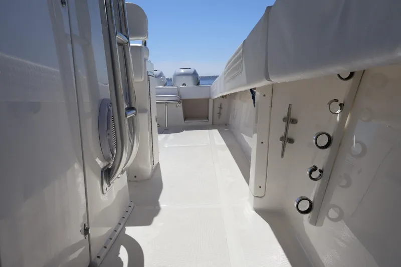  Yacht Photos Pics 2005 Venture 39 Open boat interior with sleek white deck and fittings.