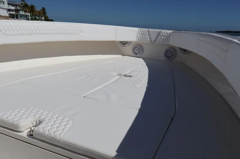  Yacht Photos Pics Luxurious seating area on a 2005 Venture 39 Open boat, featuring white cushioned upholstery.
