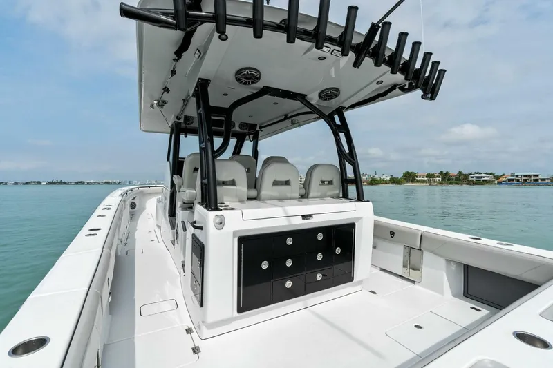  Yacht Photos Pics 2022 Barker Boatworks 40 High Performance Cat on calm water, featuring sleek design and spacious deck.