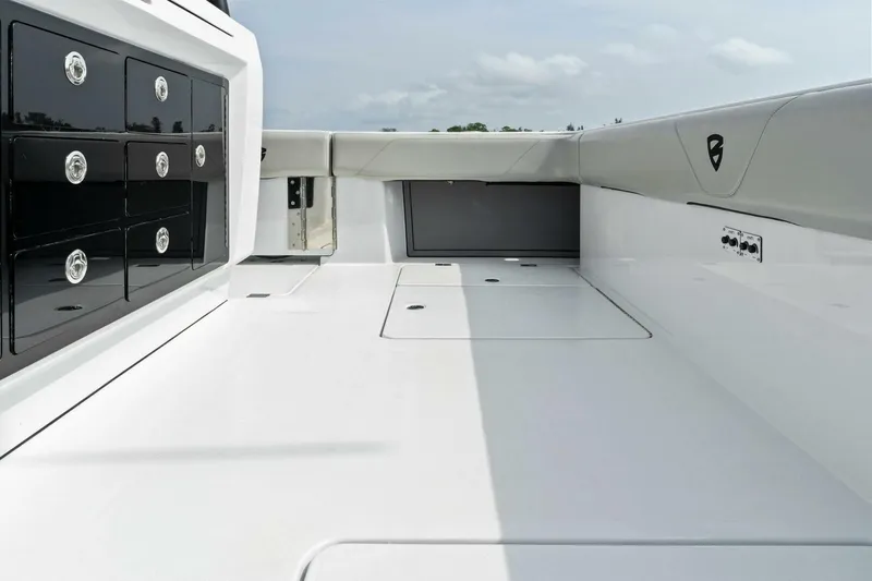  Yacht Photos Pics 2022 Barker Boatworks 40 High Performance Cat deck with storage compartments and sleek design.