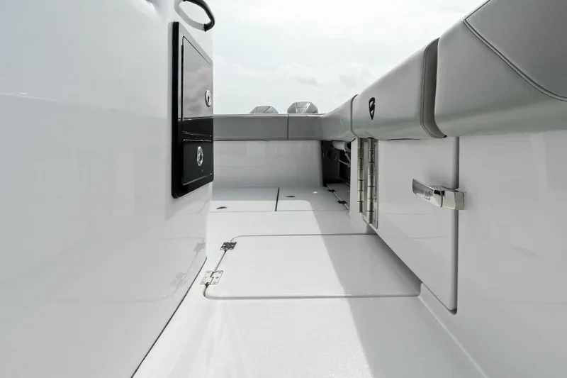  Yacht Photos Pics 2022 Barker Boatworks 40 High Performance Cat interior, featuring sleek white design and storage compartments.