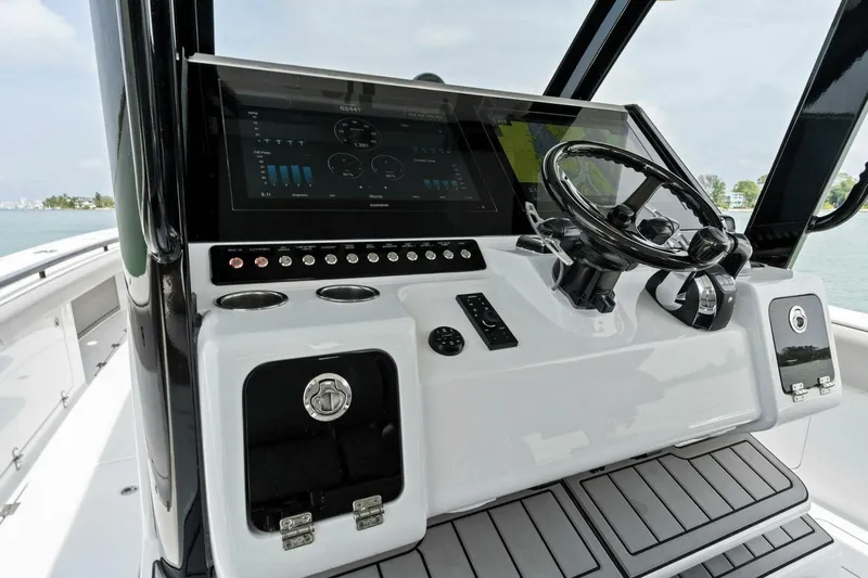  Yacht Photos Pics 2022 Barker Boatworks 40 High Performance Cat cockpit with modern controls and steering wheel.