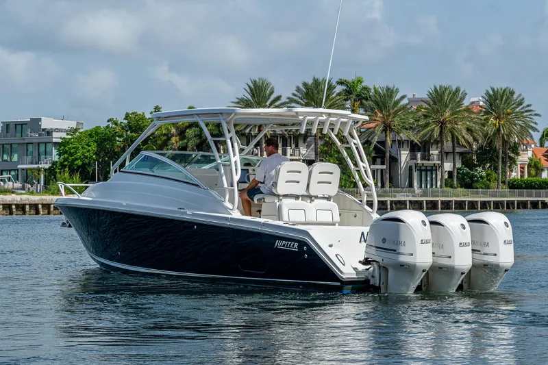 Naider's Yacht Photos Pics 2016 Jupiter 34 LX boat with triple Yamaha engines on a sunny waterway.