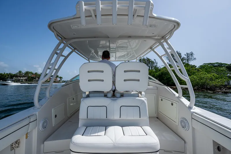 Naider's Yacht Photos Pics 2016 Jupiter 34 LX boat interior with white seating, cruising on a sunny day.