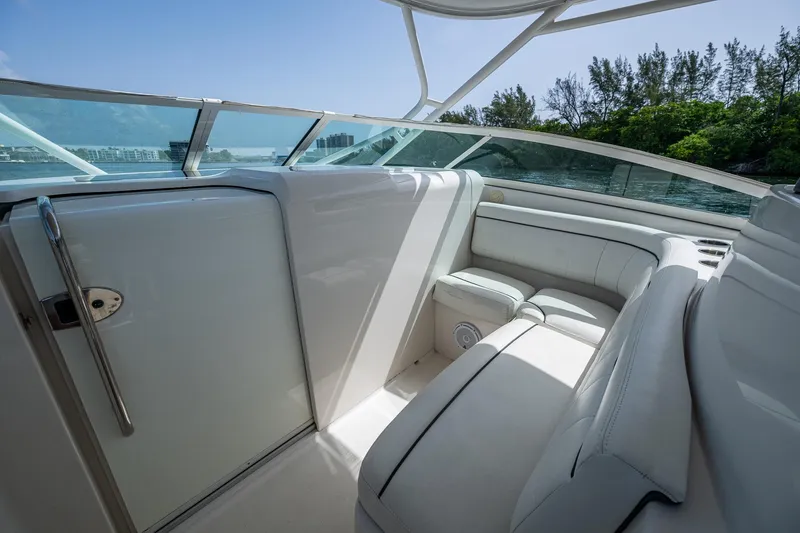 Naider's Yacht Photos Pics Luxurious interior of 2016 Jupiter 34 LX boat with white seating and scenic view.
