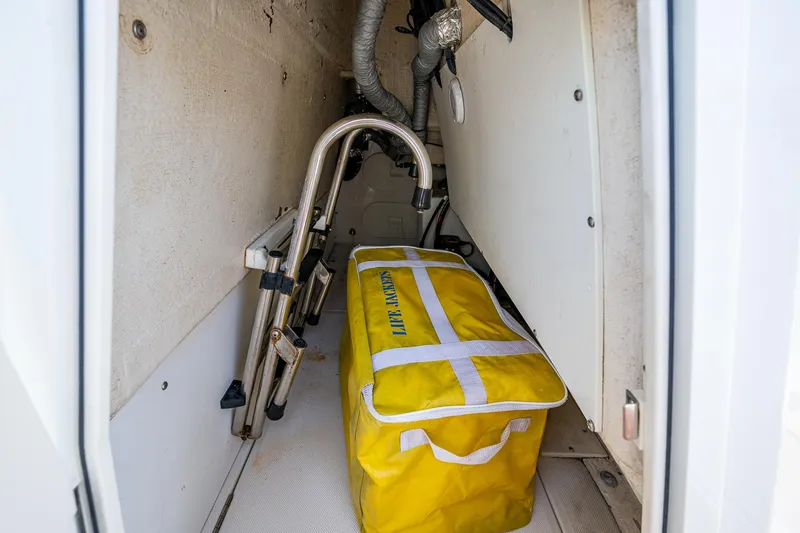 Naider's Yacht Photos Pics Storage compartment in 2016 Jupiter 34 LX boat with yellow life jacket bag.