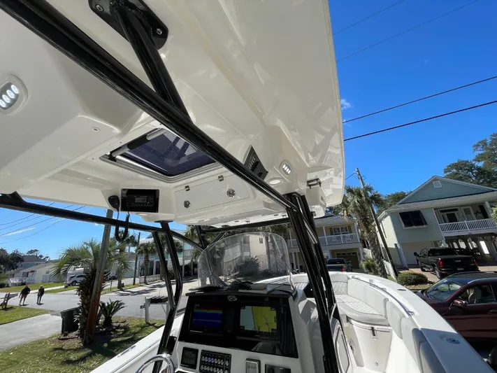  Yacht Photos Pics 2024 Sea Fox 288 Commander boat interior with advanced navigation system and sleek design.