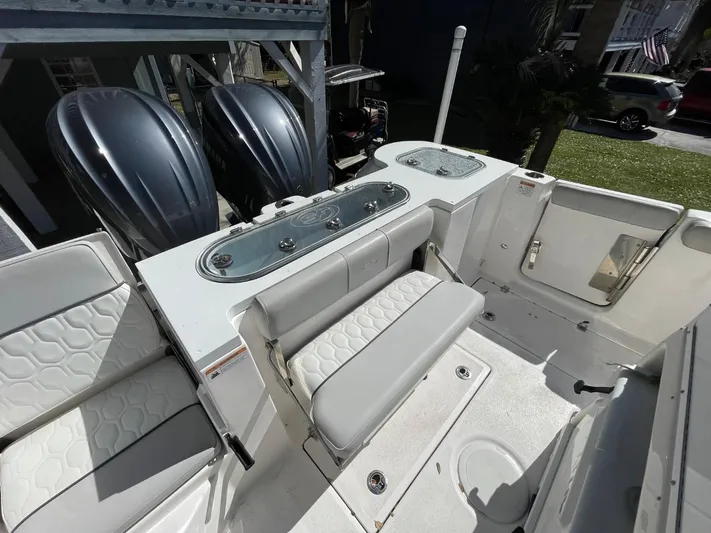  Yacht Photos Pics 2024 Sea Fox 288 Commander boat interior with dual engines and seating area.